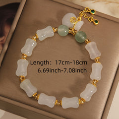 A stylish unisex lucky charm bracelet featuring natural white and green stone beads, A meaningful gift promoting harmony, positive energy, and spiritual balance.