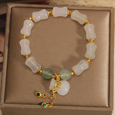A stylish unisex lucky charm bracelet featuring natural white and green stone beads, A meaningful gift promoting harmony, positive energy, and spiritual balance.
