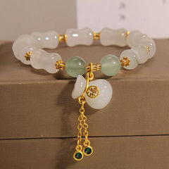 A stylish unisex lucky charm bracelet featuring natural white and green stone beads, A meaningful gift promoting harmony, positive energy, and spiritual balance.