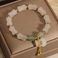 A stylish unisex lucky charm bracelet featuring natural white and green stone beads, A meaningful gift promoting harmony, positive energy, and spiritual balance.