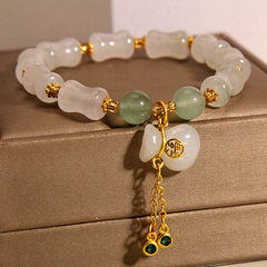 A stylish unisex lucky charm bracelet featuring natural white and green stone beads, A meaningful gift promoting harmony, positive energy, and spiritual balance.
