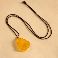 Golden Buddha Amber Necklace for Prosperity, Protection, and Spiritual Peace