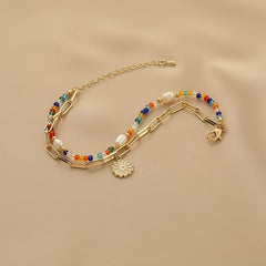 Bohemian Golden-Tone Beaded Bracelet — Joy & Creativity Enhancer with Daisy Charm