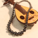 Vintage Black Bead Necklace with Lute Charm for Protection, Grounding & Elegant Style