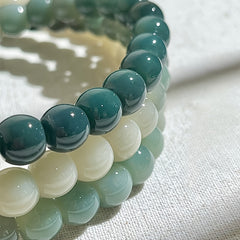 108-Bead Gradient Green–White Bodhi Root Mala — Lotus Charm for Mindful Harmony, Spiritual Balance & Grounding Energy