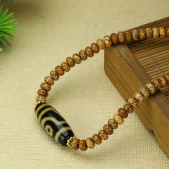 Tibetan Two-Eyed Dzi Bead Bracelet for Protection, Balance & Spiritual Insight