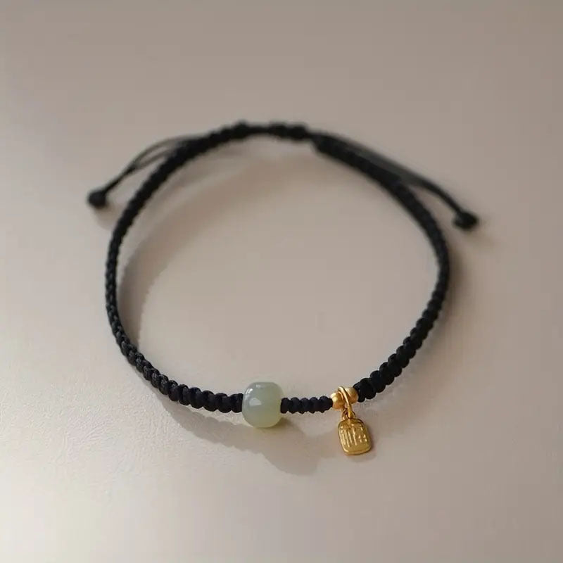 Red & Black Braided Rope Lucky Bracelet — Jade Energy Bead, Golden Charm, Protection & Harmony Wristband