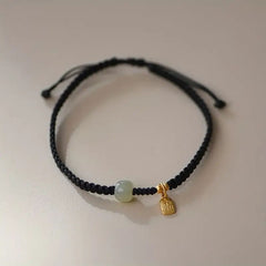 Red & Black Braided Rope Lucky Bracelet — Jade Energy Bead, Golden Charm, Protection & Harmony Wristband