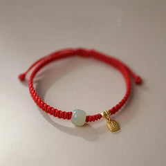 Red & Black Braided Rope Lucky Bracelet — Jade Energy Bead, Golden Charm, Protection & Harmony Wristband