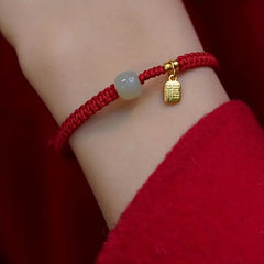 Red & Black Braided Rope Lucky Bracelet — Jade Energy Bead, Golden Charm, Protection & Harmony Wristband