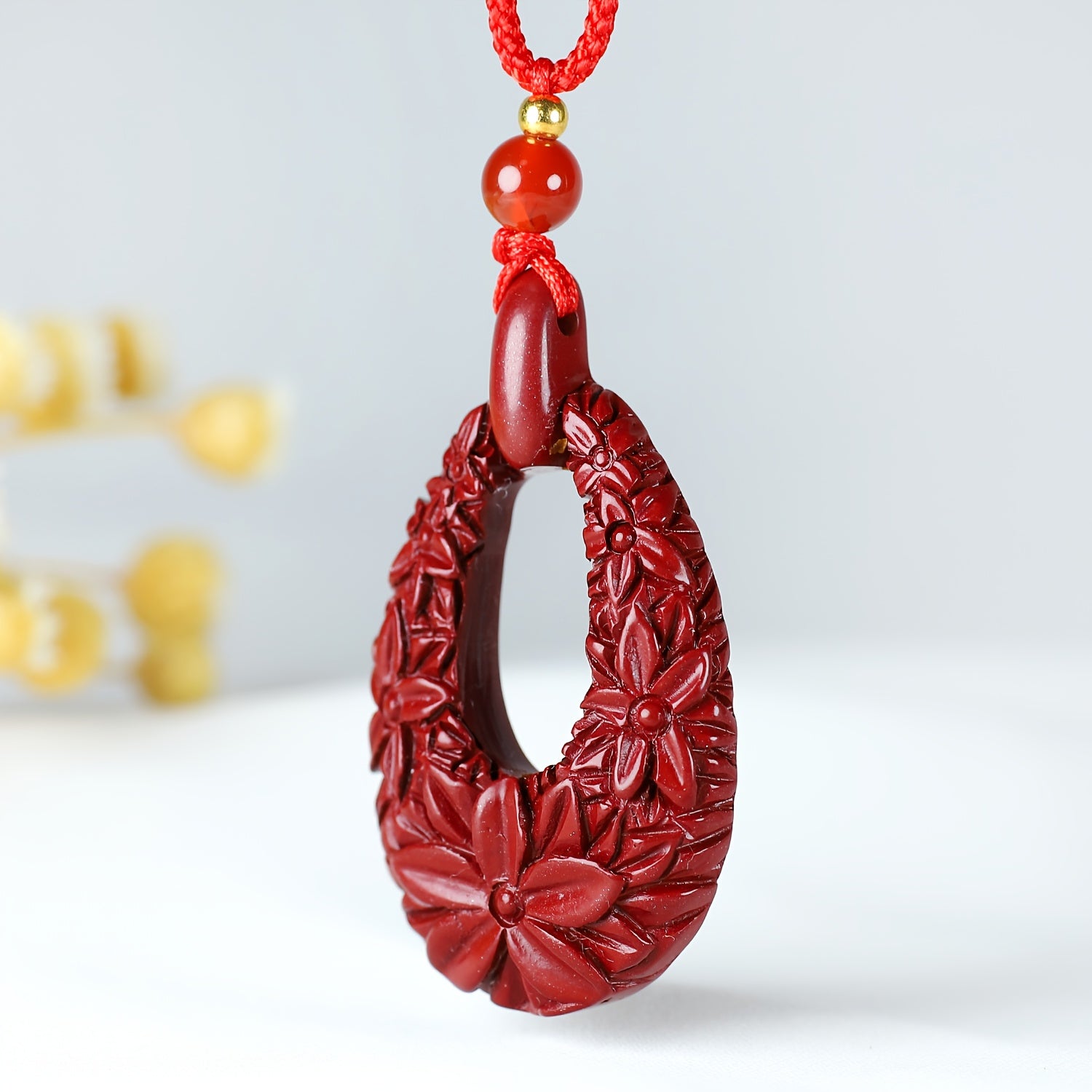 Cinnabar Flower Pendant showcasing intricate floral design