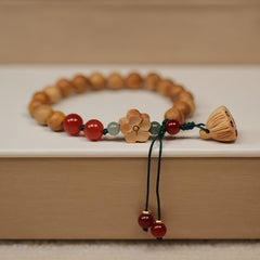 Elegant Peach Wood Lotus Pod Bracelet - Hand-Woven Plum Blossom Pattern for Spiritual Harmony & Protection