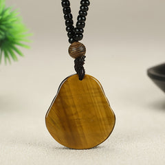 Hand-Carved Tiger's Eye Laughing Buddha Necklace for Protection and Abundance