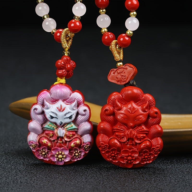 Nine-tailed fox pendant showcasing intricate hand-painted details on cinnabar stone