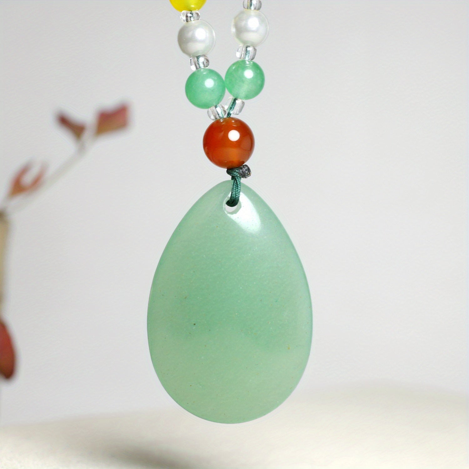 The necklace being worn, showing how it lays against the skin.