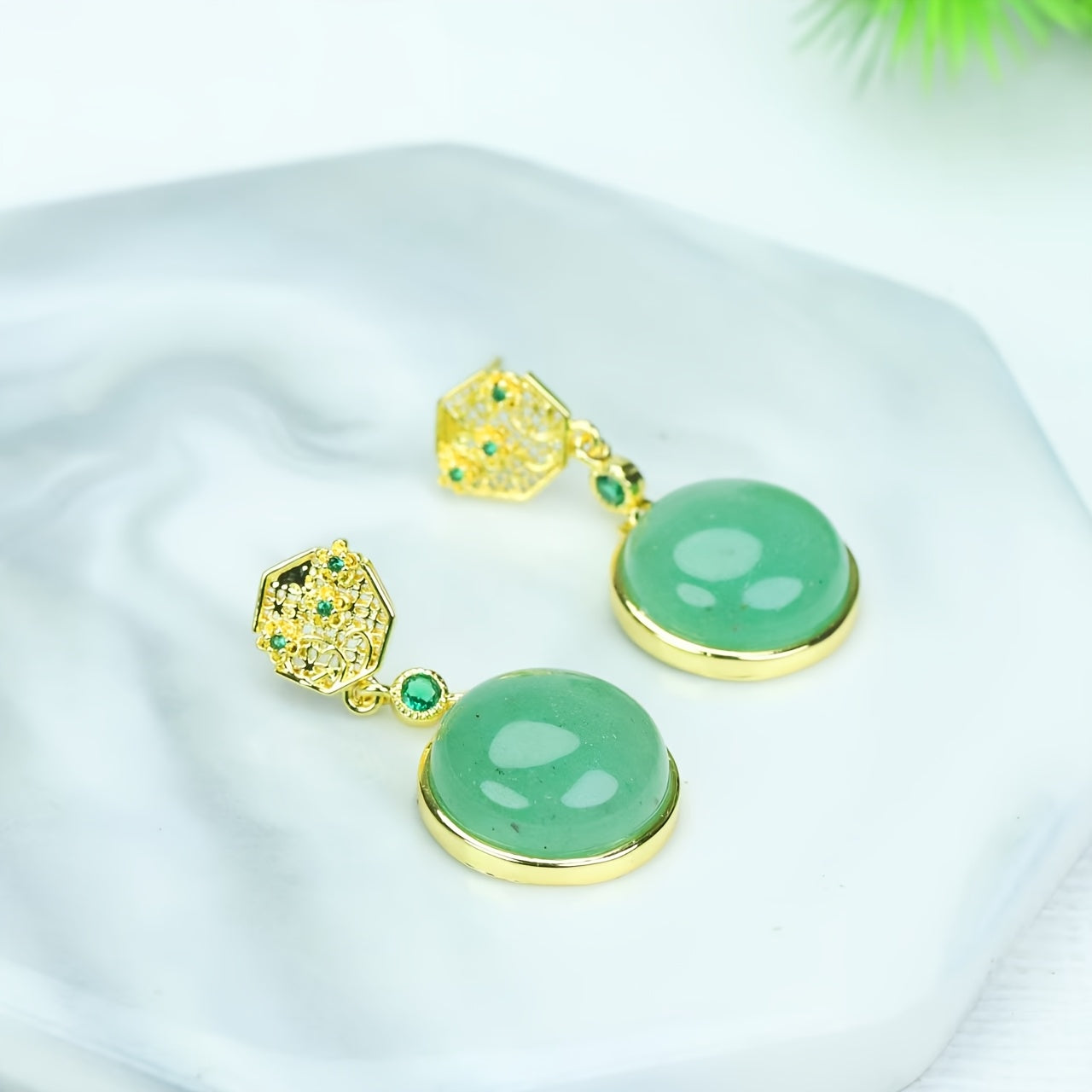 Earrings being worn in a natural, contemplative setting