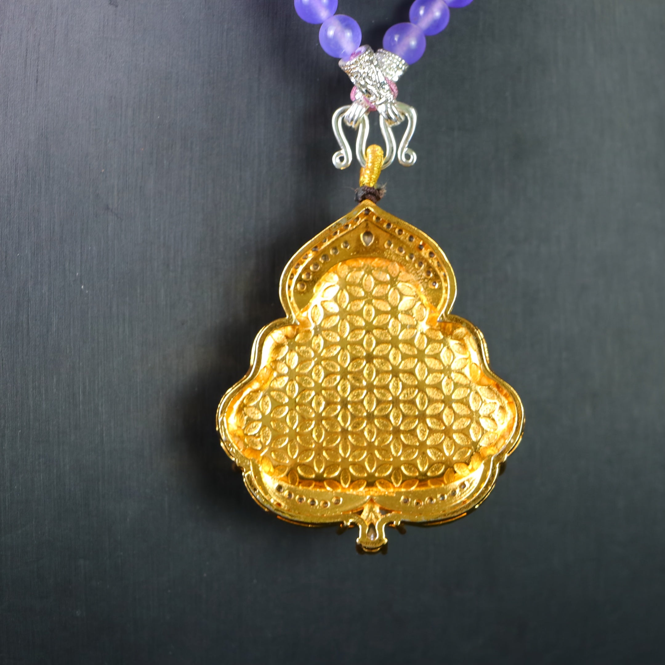 Cultural fusion in jewelry design showing Eastern symbolism with Western vintage elements