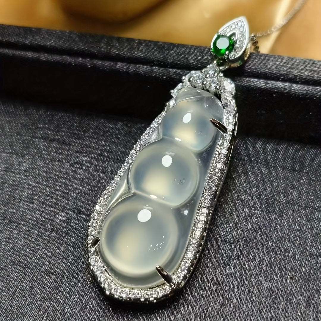 Detailed view of white agate and ice bean charms
