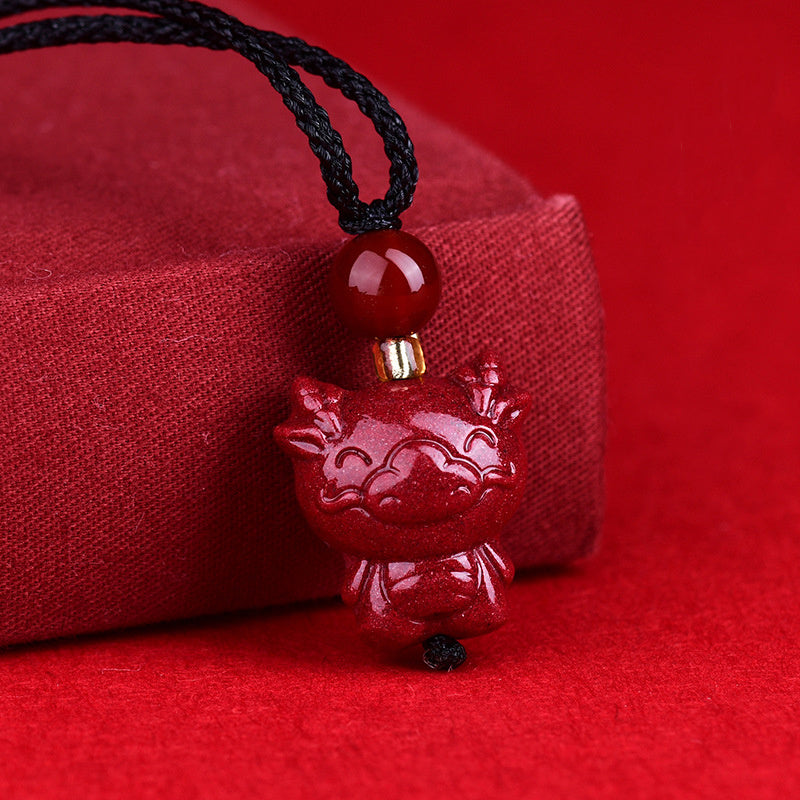Detailed view of dragon symbolism in cinnabar carving