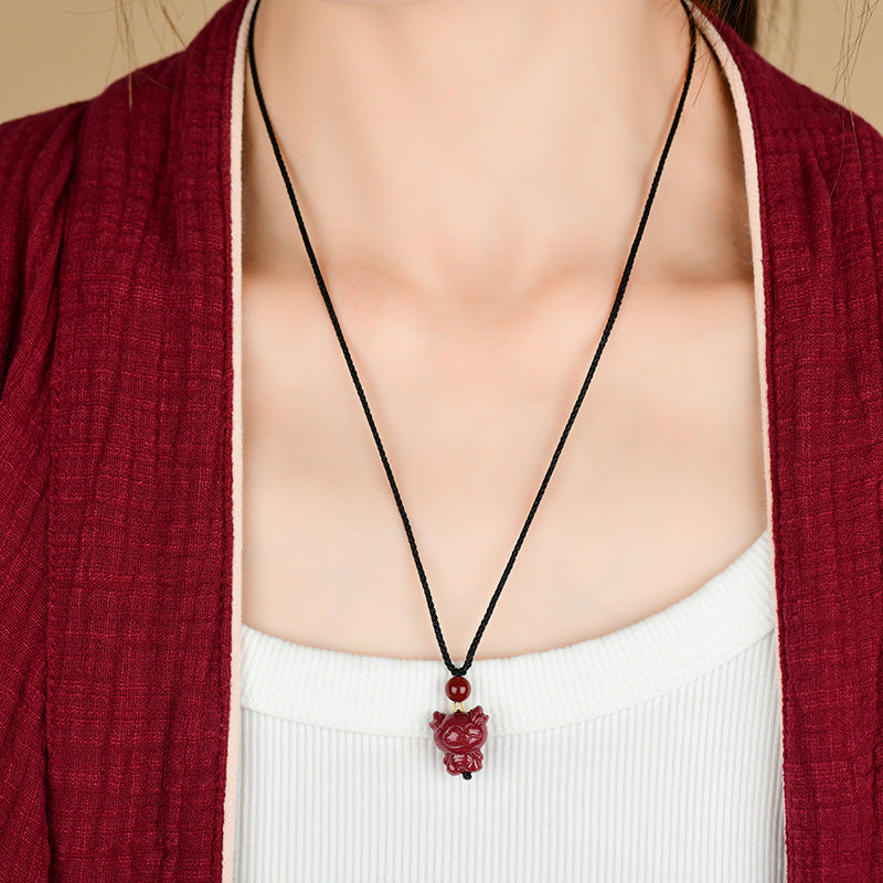 Cinnabar dragon pendant as spiritual companion