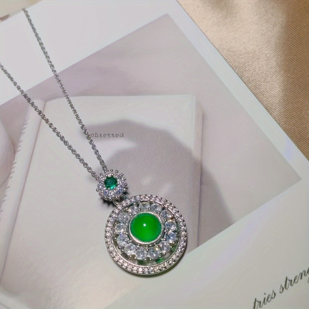 Green agate pendant in natural outdoor setting, connecting stone to nature