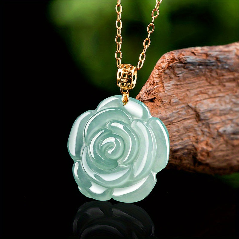 Close-up of the jade rose pendant showing the detailed carving.