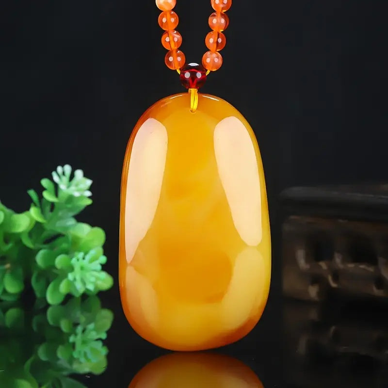 Necklace being worn, showing how it complements masculine style