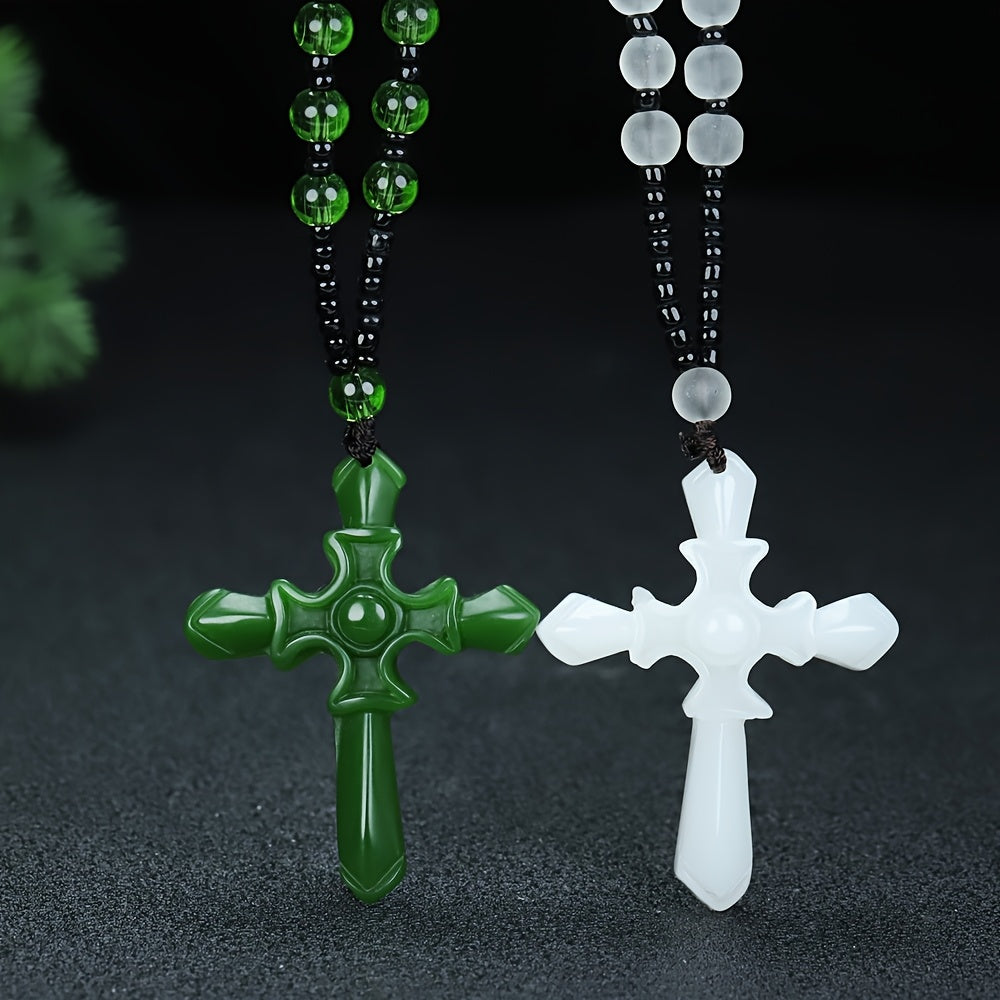 Close-up of natural green and white stones on cross pendant