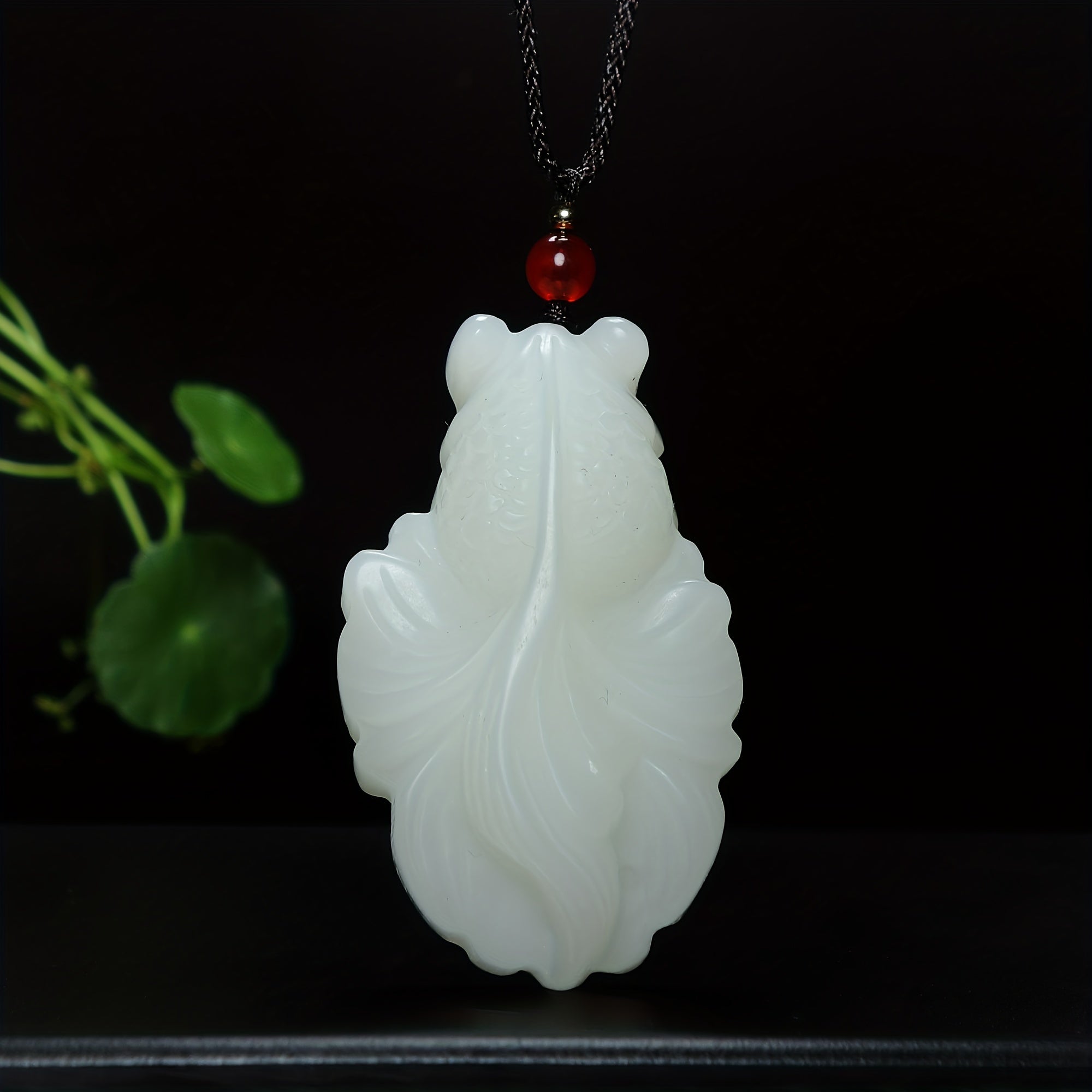 Close-up of goldfish pendant stone mosaic details