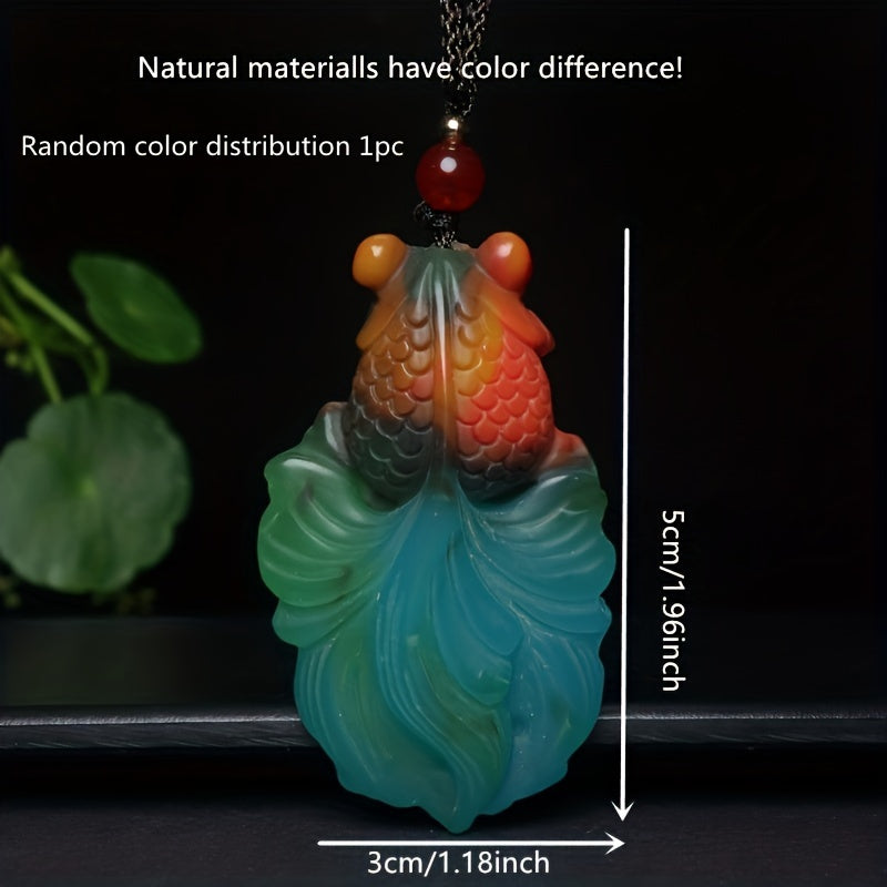 Goldfish pendant showcasing vibrant color variations
