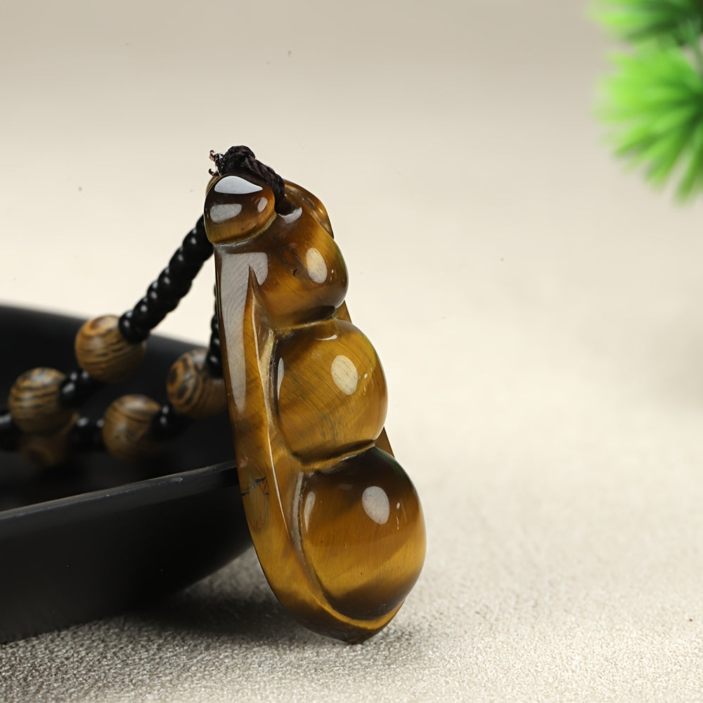 Amber bean pendant showing natural translucence and inclusions