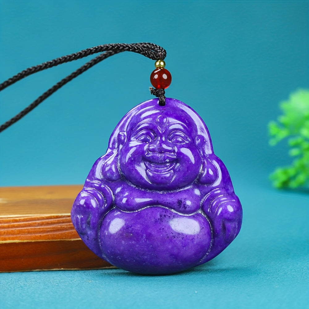 Muscovite pendant showing natural iridescence and carved smiling face symbol