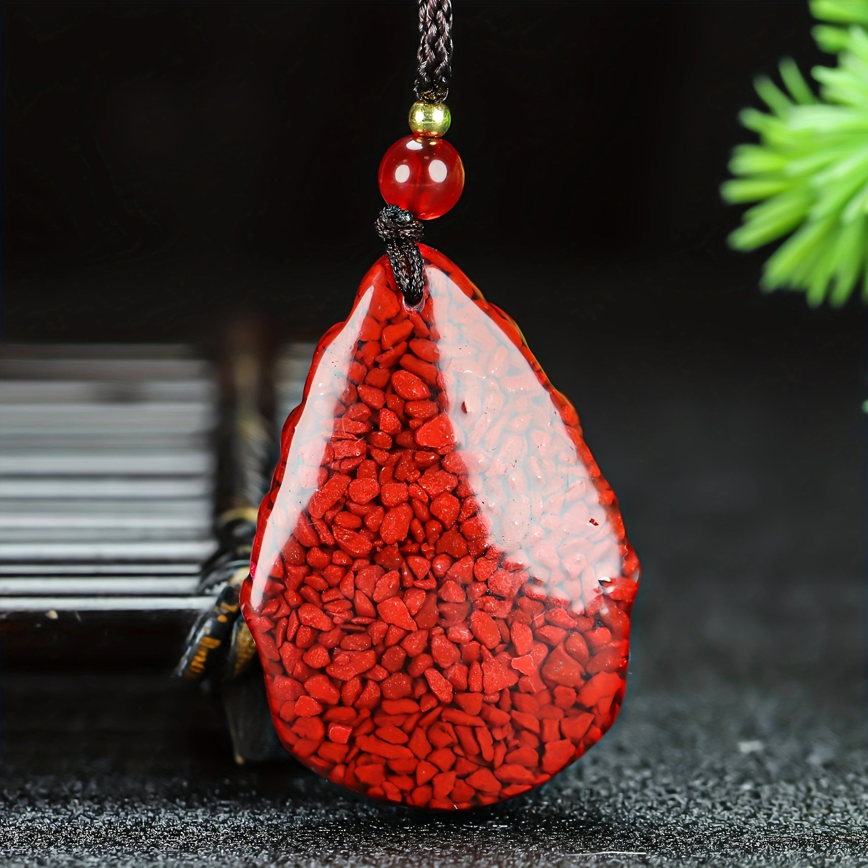 Close-up of the hand-carved nine-tailed fox cinnabar pendant