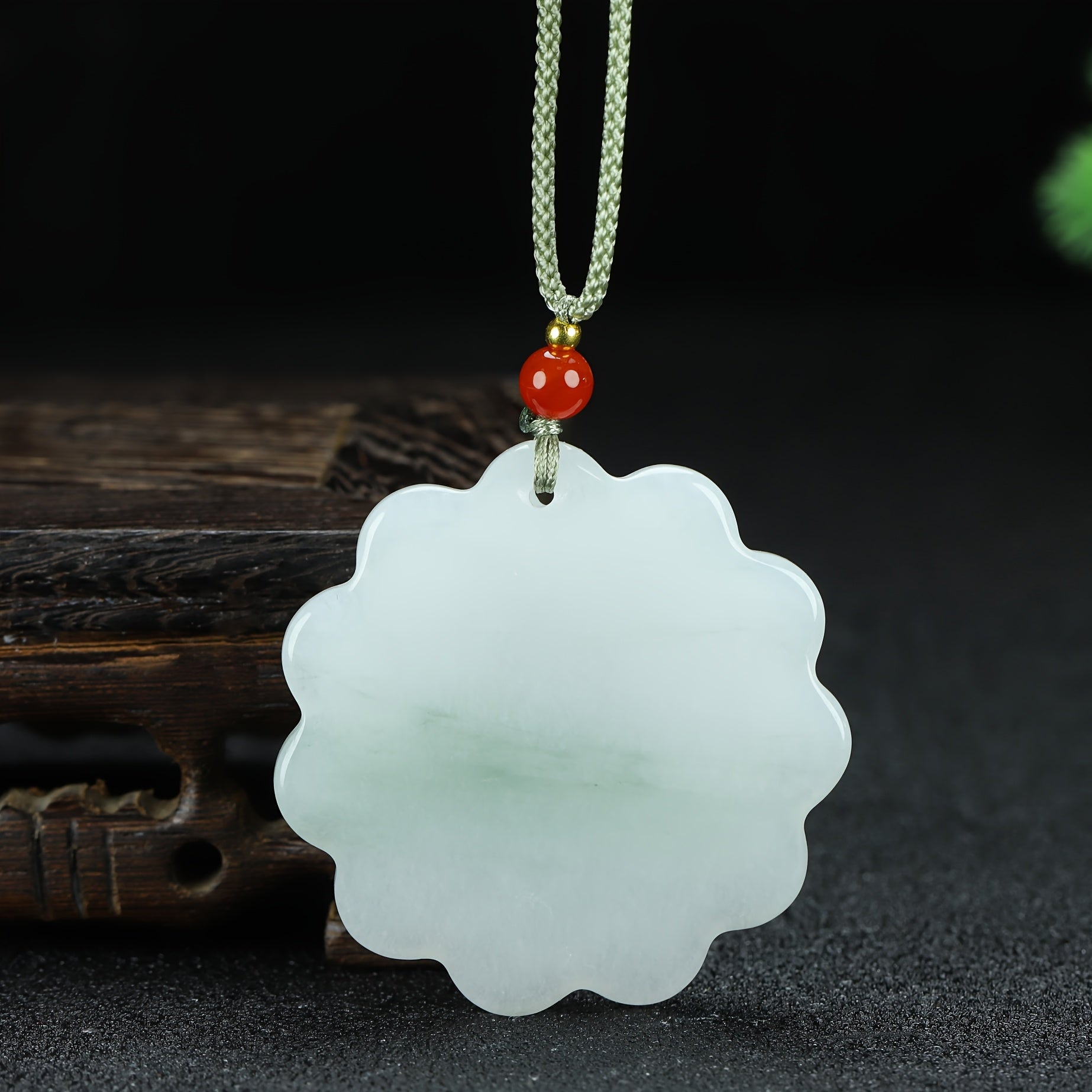 The pendant being worn, showing how it rests on the body