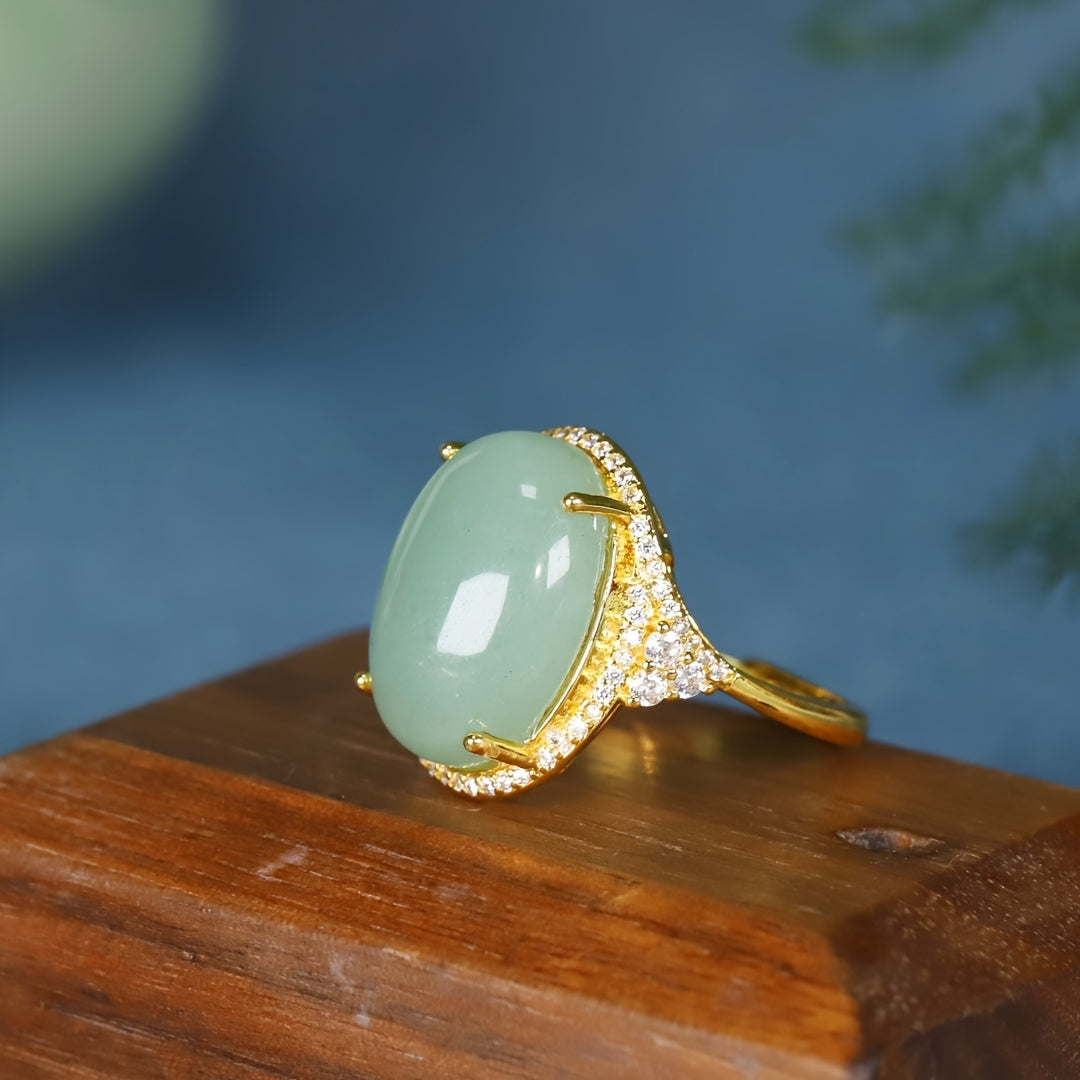 Close-up of the Green Aventurine stone in its gold-plated setting, highlighting the crystal accents.