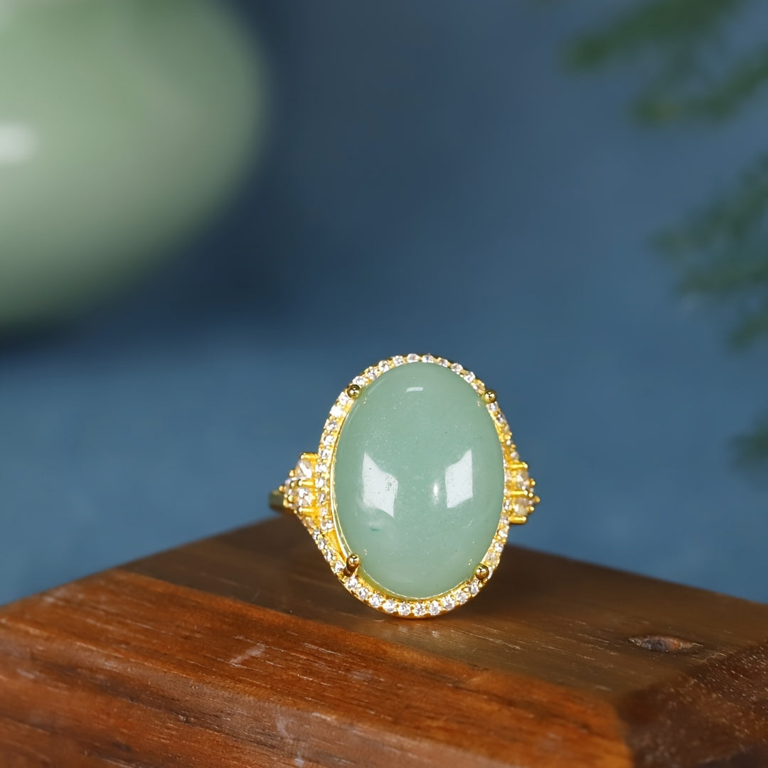 A hand wearing the Green Aventurine ring, showing its adjustable and comfortable fit.